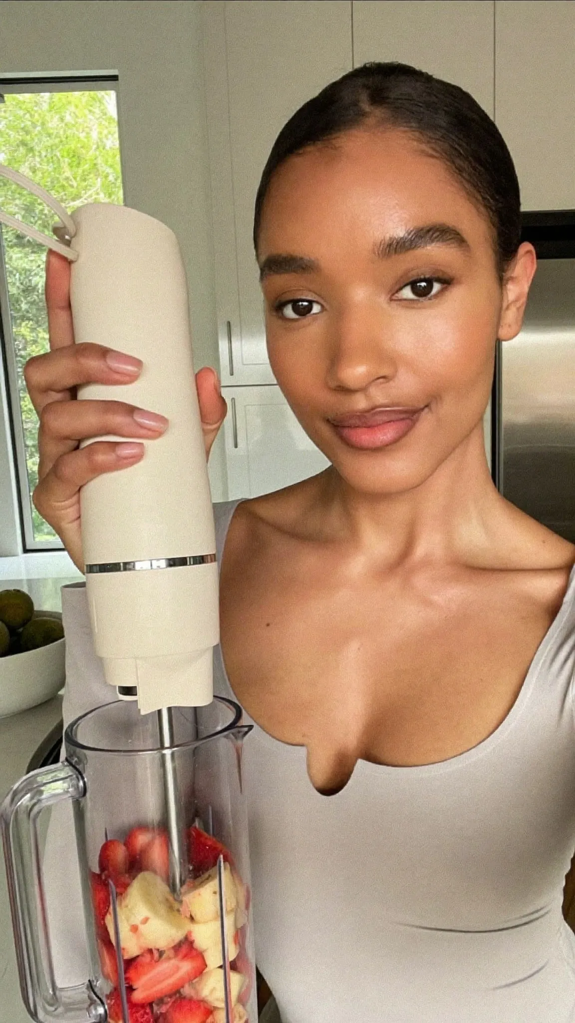 Source cut, creator demonstrating a kitchen appliance